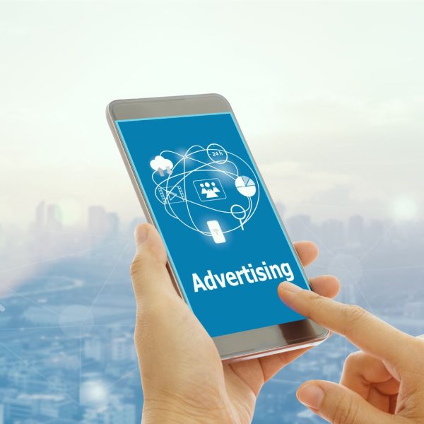 Digital ads on a smartphone screen. An illustration for PPC Ads in Dalas.