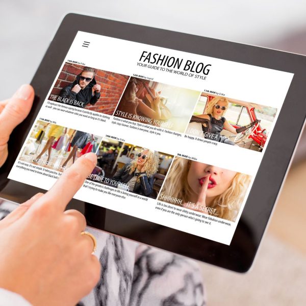 Woman Reading Fashion Blog on Tablet
