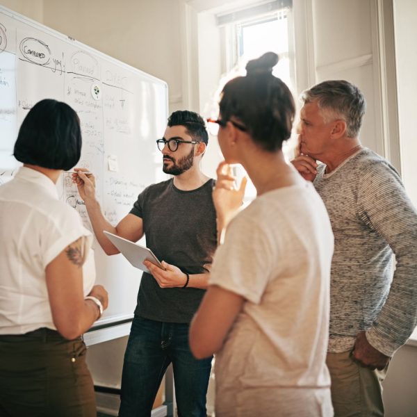 a group of marketing experts working on a SEO strategy in a Dallas marketing agency