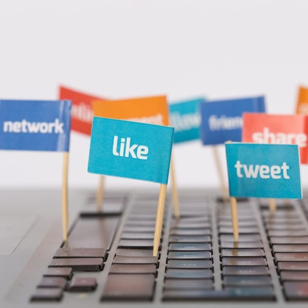 flags with social media terms on a keyboard